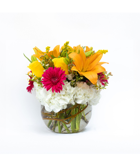 This bubble vase filled with orange lilies, hot pink gerbera daisies and yellow roses is bursting with warm wishes.