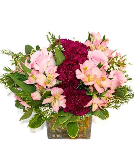 Pretty pink roses with soft lavender carnations and alstroemeria highlight this delightful bouquet.